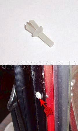Plastic rivet clip, holds rear door hinge cover to door. Each